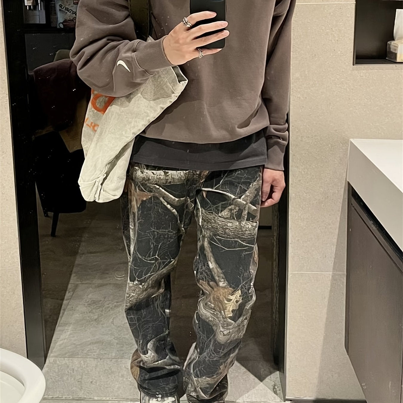 Wang Jiaer’s Camo Jeans: Graffiti Print, Lifelike Maple Leaf Design Camo Colors