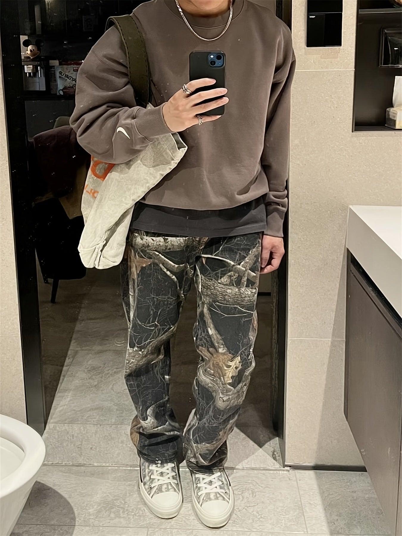 Wang Jiaer’s Camo Jeans: Graffiti Print, Lifelike Maple Leaf Design Camo Colors